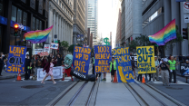 Climate activists block off a street in San Francisco's Financial District.