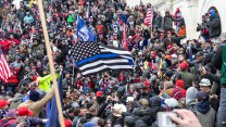 Trump supporters waving thin blue line flag