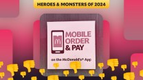 A red-tinted image of a poster advertising the McDonald's app, with thumbs-down emojis layered on top.