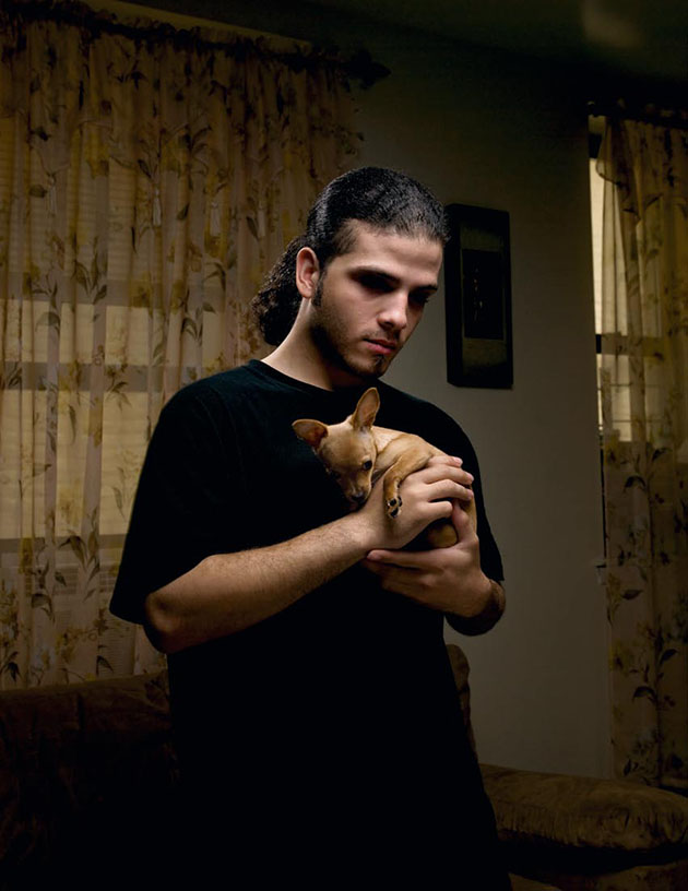 man holding small dog