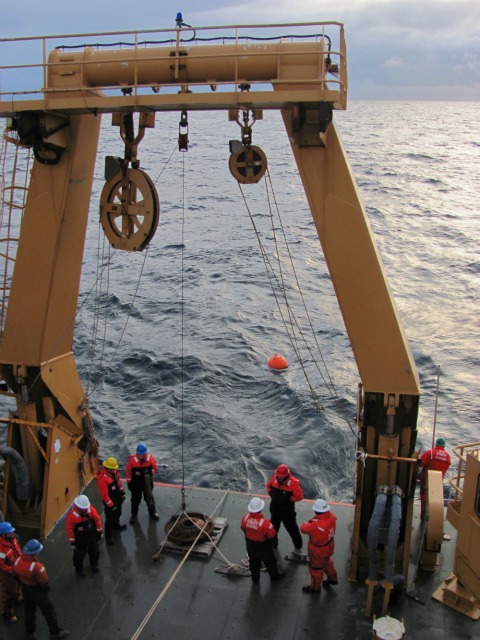 Deploying a mooring buoy from UCGC icebreaker Healy, Arctic Ocean, October 2012: Julia Whitty